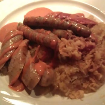 Kurt's Euro Bistro - Curry wurst plate w/ Nuernberger, Bratwurst, and Bauerwurst served w/ curry ketchup and braised sauerkraut - Modern European Near Me - Duluth, Georgia