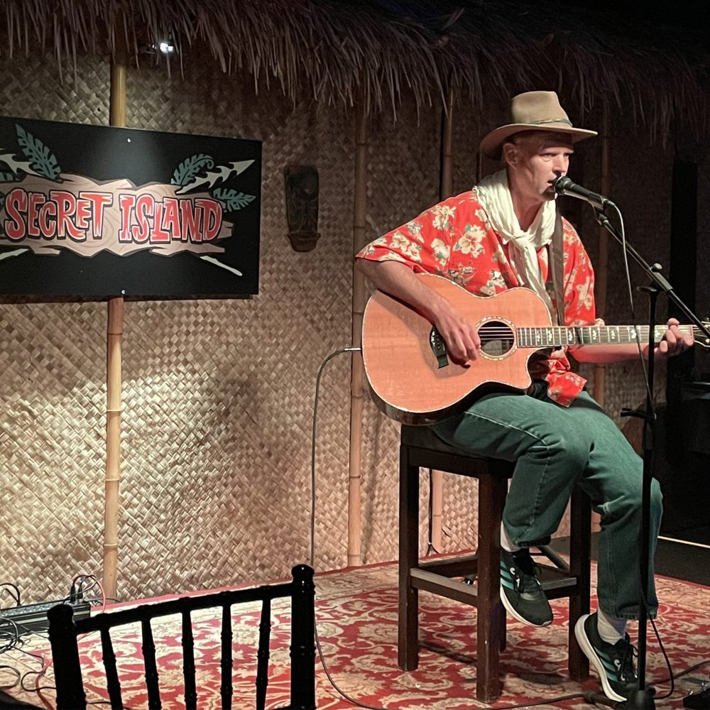 Secret Island - Come listen to Trader Dan strum great original paradise themed songs and familiar gentle melodies. Wonderful job, Dan! - Polynesian Near Me - Long Beach, California