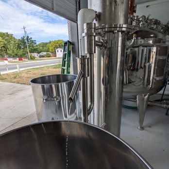 Johnny Pickles Distillery - a large stainless steel pot with water coming out of it - Beer, Wine & Spirits Near Me - Seguin, Texas Johnny Pickles Distillery - a large stainless steel pot with water coming out of it - Beer, Wine & Spirits Near Me - Seguin, Texas