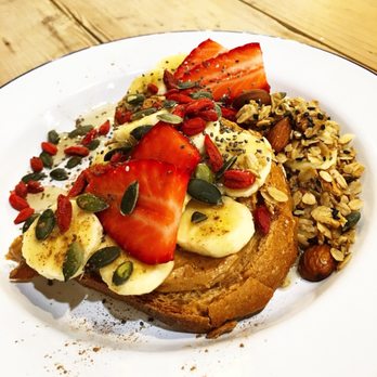 Hammock Juice Station - Peanut butter toast! Topped with strawberries, goji berries, banana, granola, pumpkin seeds, and agave - Breakfast & Brunch Near Me - Barcelona, B Hammock Juice Station - Peanut butter toast! Topped with strawberries, goji berries, banana, granola, pumpkin seeds, and agave - Breakfast & Brunch Near Me - Barcelona, B