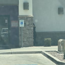 Employee smoking next to door Employee smoking next to door