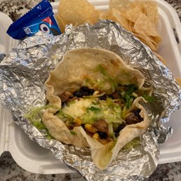 a burrito and chips a burrito and chips