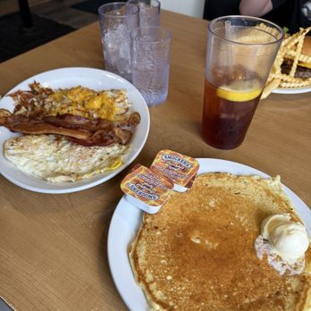 The Wheel Inn - Two Eggs, hash browns bacon with a small (yes this is their "small" pancake) instead of toast. Super tasty!!! - Breakfast & Brunch Near Me - Watertown, South Dakota The Wheel Inn - Two Eggs, hash browns bacon with a small (yes this is their "small" pancake) instead of toast. Super tasty!!! - Breakfast & Brunch Near Me - Watertown, South Dakota