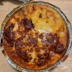 Cosenza Pizza & Restaurant - Meatloaf parmesan, smothered in toasted cheese on a bed of parmesan mashed potatoes with a delectable tomato sauce. Chef's kiss!