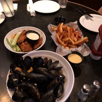 Chickie's & Pete's - Two fries platter (super yummy), buffalo chicken wings (okay) and white sauce mussels (good) - Sports Bars Near Me - Audubon, Pennsylvania Chickie's & Pete's - Two fries platter (super yummy), buffalo chicken wings (okay) and white sauce mussels (good) - Sports Bars Near Me - Audubon, Pennsylvania