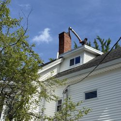 Boxford Chimney Sweep - They scampered up on the roof like it was nothing, then carefully fed the liner down through the old chimney.