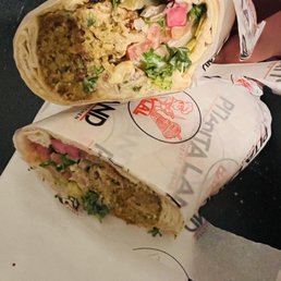 Falafel wrap with sooo many toppings and sauces to choose from. The falafel are so fresh, warm n fluffy but light! Yummy Falafel wrap with sooo many toppings and sauces to choose from. The falafel are so fresh, warm n fluffy but light! Yummy