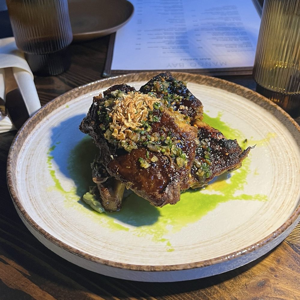 Mango Bay - Pomegranate glazed ribs of pork - Caribbean Near Me - Brooklyn, New York Mango Bay - Pomegranate glazed ribs of pork - Caribbean Near Me - Brooklyn, New York