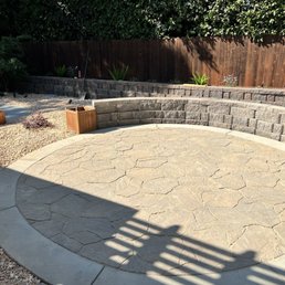 Seating area for chairs and a gas fire pit.