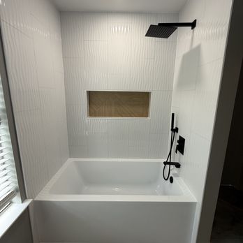 Skillful Solutions Home Makeovers - "Clean lines, bright whites, and timeless style Modern white tile and a fresh bathtub upgrade bring spa-like serenity to this space. - Painters Near Me - Grand Prairie, Texas Skillful Solutions Home Makeovers - "Clean lines, bright whites, and timeless style Modern white tile and a fresh bathtub upgrade bring spa-like serenity to this space. - Painters Near Me - Grand Prairie, Texas