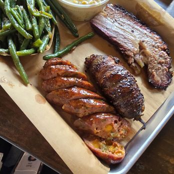 Hutchins BBQ - Top to bottom: Brisket Texas Twinky Jalapeño cheddar sausage. - Barbeque Near Me - Frisco, Texas Hutchins BBQ - Top to bottom: Brisket Texas Twinky Jalapeño cheddar sausage. - Barbeque Near Me - Frisco, Texas