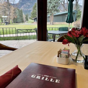 The Grille - a table with a menu on it - American Near Me - Colorado Springs, Colorado