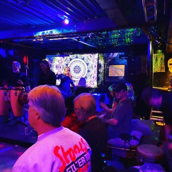 Barzarre - a group of people sitting at a bar - Hookah Bars Near Me - Wilmington, North Carolina Barzarre - a group of people sitting at a bar - Hookah Bars Near Me - Wilmington, North Carolina