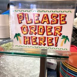 a sign that says please order here a sign that says please order here