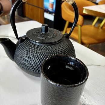 Sakura Sushi House - Pretty, traditional Japanese tea pot full of green tea. - Sushi Bars Near Me - Willows, California