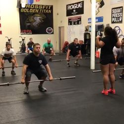 CrossFit Golden Titan - Coach Angela teaching clean technique.