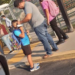 Fallbrook Street Elementary School - The school giving out masks and breakfast before entering school because of pandemic