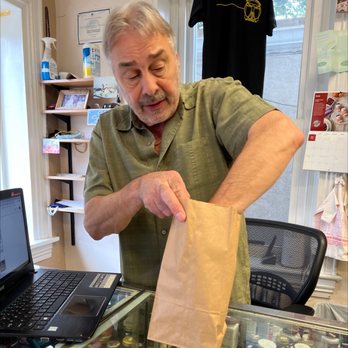 Stans Vitamins & Supplements - a man putting a bag of vitamins in front of a laptop - Vitamins & Supplements Near Me - Doylestown, Pennsylvania Stans Vitamins & Supplements - a man putting a bag of vitamins in front of a laptop - Vitamins & Supplements Near Me - Doylestown, Pennsylvania