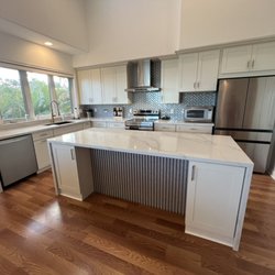 Aok Cabinets & Stone - New kitchen remodel  White shaker cabinets, quartz waterfall island, stainless appliances & a modern backsplash.