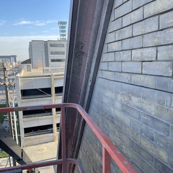 Grand Modern Builders - Grinding out mortar joints for tuckpointing level 5 historical restoration - General Contractors Near Me Grand Modern Builders - Grinding out mortar joints for tuckpointing level 5 historical restoration - General Contractors Near Me