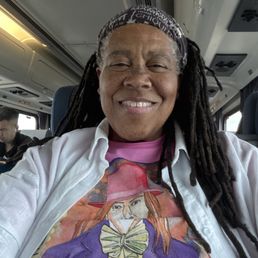 Kiki with Darrin on a tee.