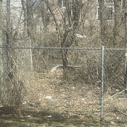 Parkview Estates - This is behind this chain-link they put up and i have a view of all this trash in this forest preserve behind this fence