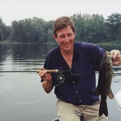 Penobscot Guide Service - Tony holding a nice Smallmouth Bass from the famous Penobscot River, caught  with a fly rod