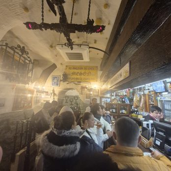 El Mesón del Champiñón - it was a total madhouse when we were there. We ended up getting it to go and eating it in the alley - Spanish Near Me - Madrid, M El Mesón del Champiñón - it was a total madhouse when we were there. We ended up getting it to go and eating it in the alley - Spanish Near Me - Madrid, M