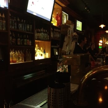 Mill Cue Club - a bar with a large screen tv - Pool Halls Near Me - Tempe, Arizona