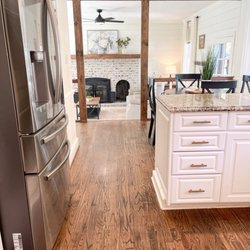 Seven Hills Design  - Beautiful view from open concept kitchen and breakfast area, looking into family room with fireplace and shiplap.