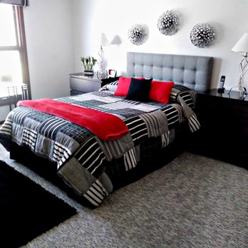 Michael's Floor Covering - a bedroom with a bed and a rug - Carpeting Near Me - Fort Wayne, Indiana