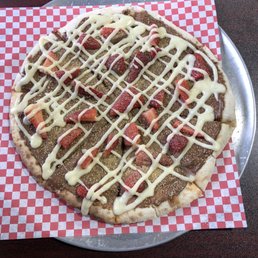 Dessert Pizza with chocolate, strawberries and icing