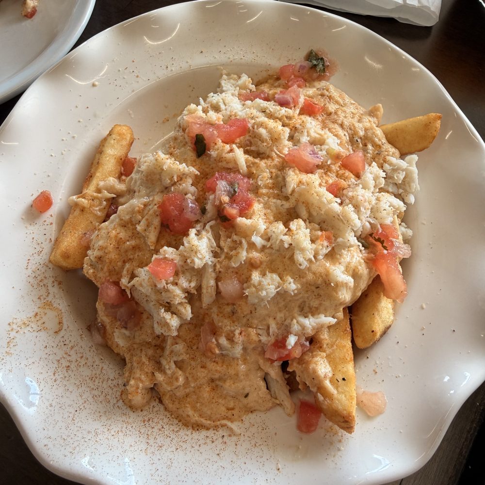 Calvert Crabs & Seafood - Expecting fries with Old Bay seasoning, they came smothered with crabmeat and a delicious sauce. OMG! - Seafood Near Me - Prince Frederick, Maryland