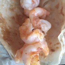 Taco Factory - Like the grilled fish tacos. The grilled shrimp tacos are large & in charge. Best on the Malacon. Add what you want.