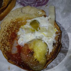 McDonald's - looks like they took a regular mcdouble and scrapped everything off it bc you can still see where the mustard was