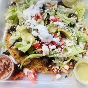 Taqueria Chalupas - Tasty Crunchy Chalupa with chopped fajita beef and spicy green salsa and sweet red salsa. - Mexican Near Me - Webster, Texas Taqueria Chalupas - Tasty Crunchy Chalupa with chopped fajita beef and spicy green salsa and sweet red salsa. - Mexican Near Me - Webster, Texas