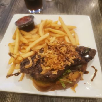 Judi's Lounge Bar & Grill - Open steak sandwich with onion drizzles and fries - Chicken Wings Near Me - Niagara Falls, New York