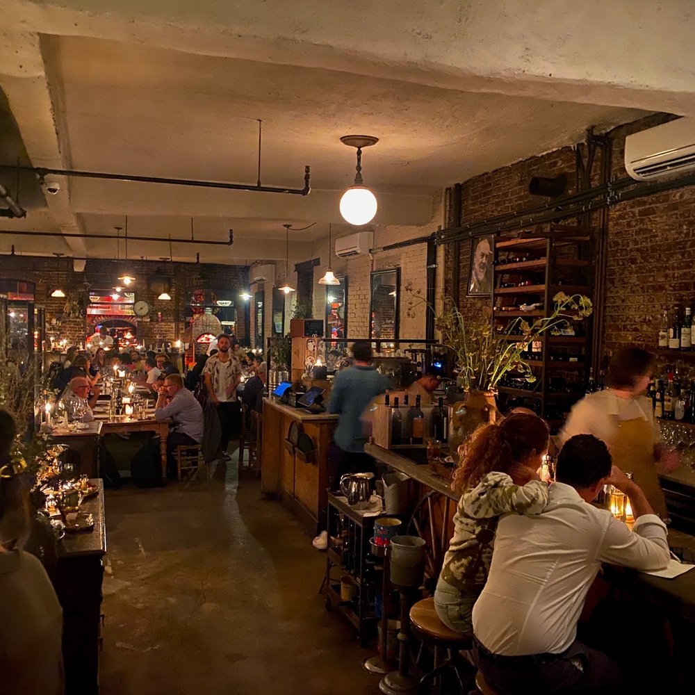Peasant - a crowded bar with people sitting at the bar - Italian Near Me - New York, New York Peasant - a crowded bar with people sitting at the bar - Italian Near Me - New York, New York
