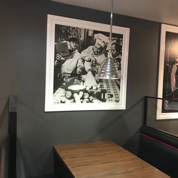Little Angie's Restaurant - a black and white photograph of a man eating - American Near Me - Hemet, California