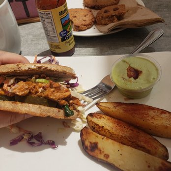 Trilogy Sanctuary - bbq "pork" aka jackfruit sandwich w potato wedges, cilantro dip, and choco cookies !!! - Juice Bars & Smoothies Near Me - La Jolla, California