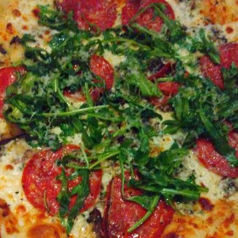 Puttery - Mushroom & truffle pizza with arugula to share. The added pepperoni on top was *chef's kiss*!! - Mini Golf Near Me - The Colony, Texas