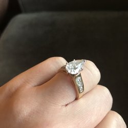 Tacoma Custom Jewelers - Pear shaped engagement ring - 18K gold band with accent diamonds. Tacoma Custom Jewelers