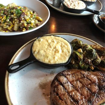 Grace & Grit - Pork chops, Brussels sprouts, jalapeño cheddar grits, succotash - Southern Near Me - Mount Pleasant, South Carolina