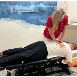 Global Chiropractic - Plano/Frisco - Dr. Shelton adjusting a patient. Want to find out how we can help you? Give us a call!
