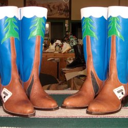 DEW'S CUSTOM HANDMADE BOOTS - Our boots have redwood trees reaching into the fog, complete with burned out trunk and our little trailer. We love them.