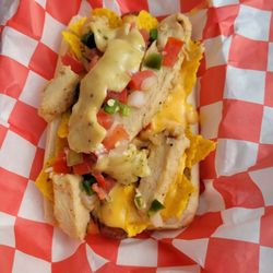 KC's Dawgs - Kc's chicken nacho dog grilled chicken ,queso cheese chips ,pico de gallo, and jalapeno Mayo.