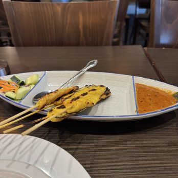 Coconut Bay - chicken satay with the best satay and cucumber salad. $8 at Happy Hour - Thai Near Me - Burlingame, California Coconut Bay - chicken satay with the best satay and cucumber salad. $8 at Happy Hour - Thai Near Me - Burlingame, California