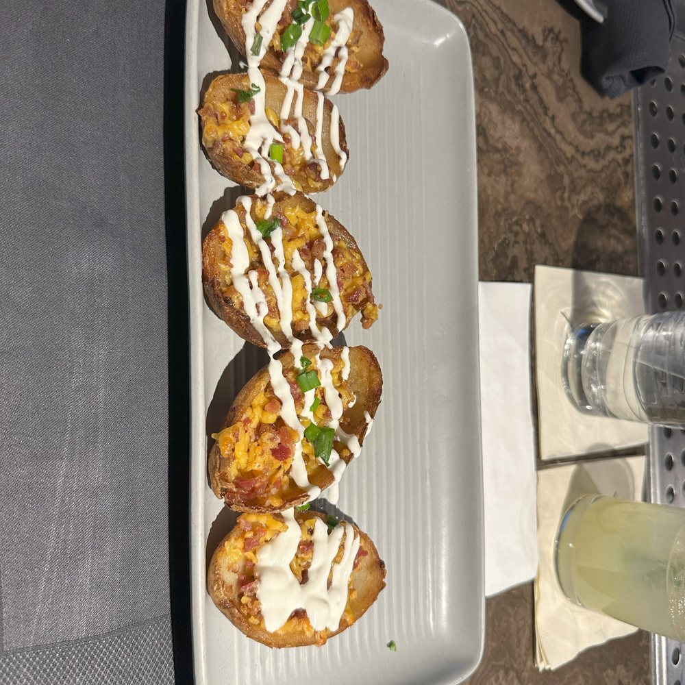 Raiders Tavern & Grill - loaded potato skins - American Near Me - Henderson, Nevada Raiders Tavern & Grill - loaded potato skins - American Near Me - Henderson, Nevada