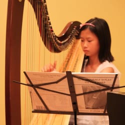 East-West Music School - Our harp and violin student