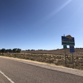 BedRock Depot - a road sign on the side of the road - Ice Cream & Frozen Yogurt Near Me - Dinosaur, Colorado